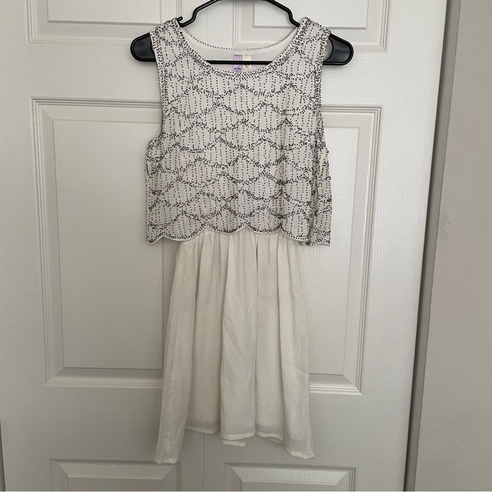 Francesca’s retro white beaded dress